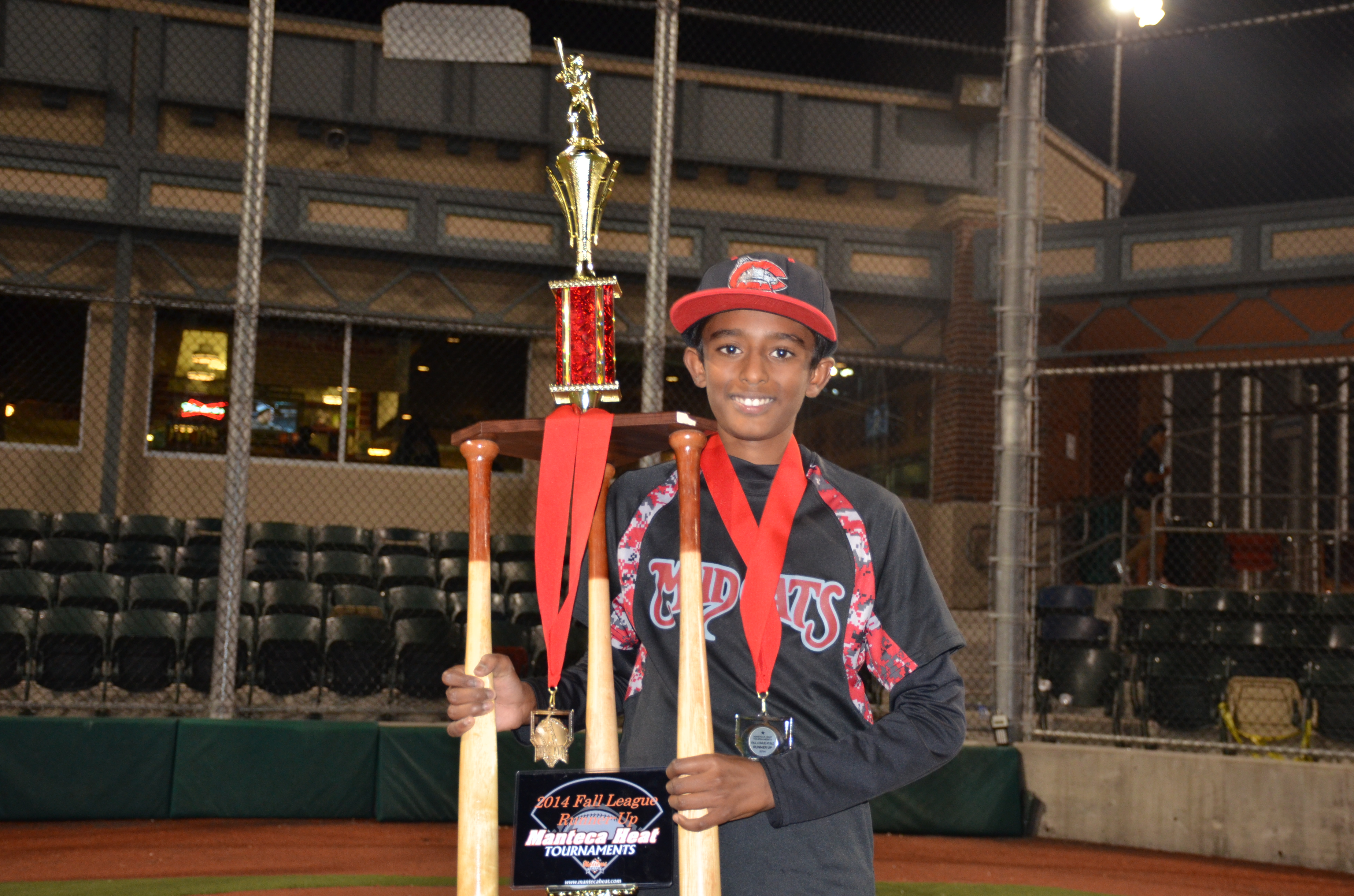 Deepa's son poses with a trophy